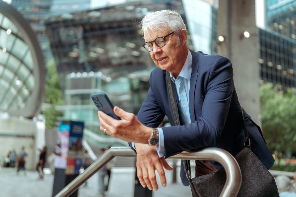 Business owner on her mobile at her desk